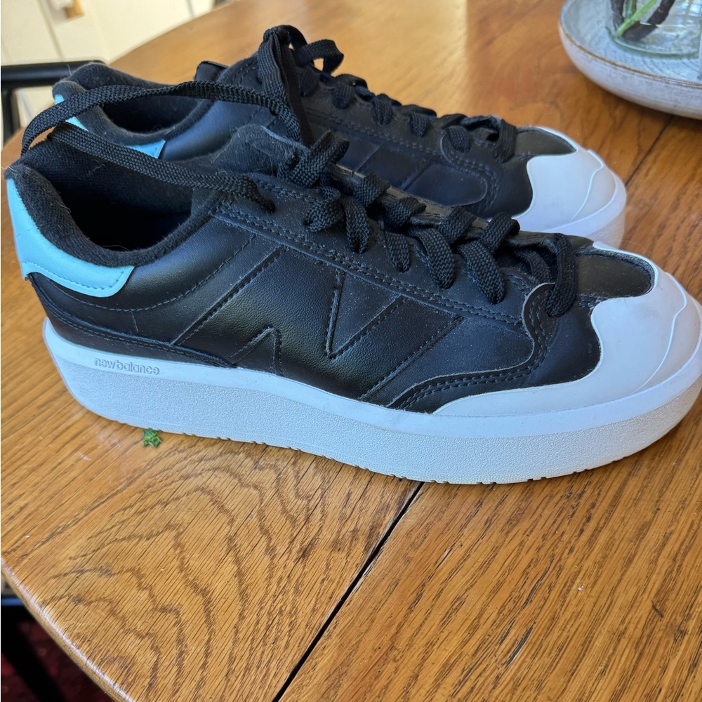 New Balance Mens 8/Women’s 9.5 - Black and White Sneakers with Blue Accent